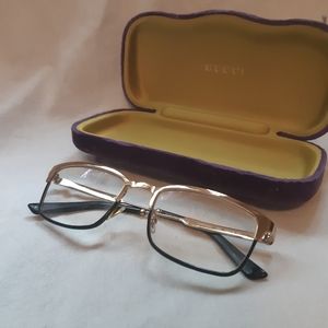 Gucci Gold & Black framed glasses